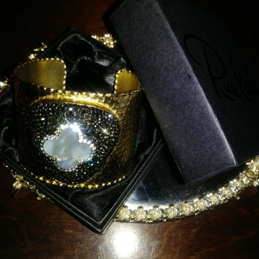 Hammered gold cuff w/ mother of pearl details.